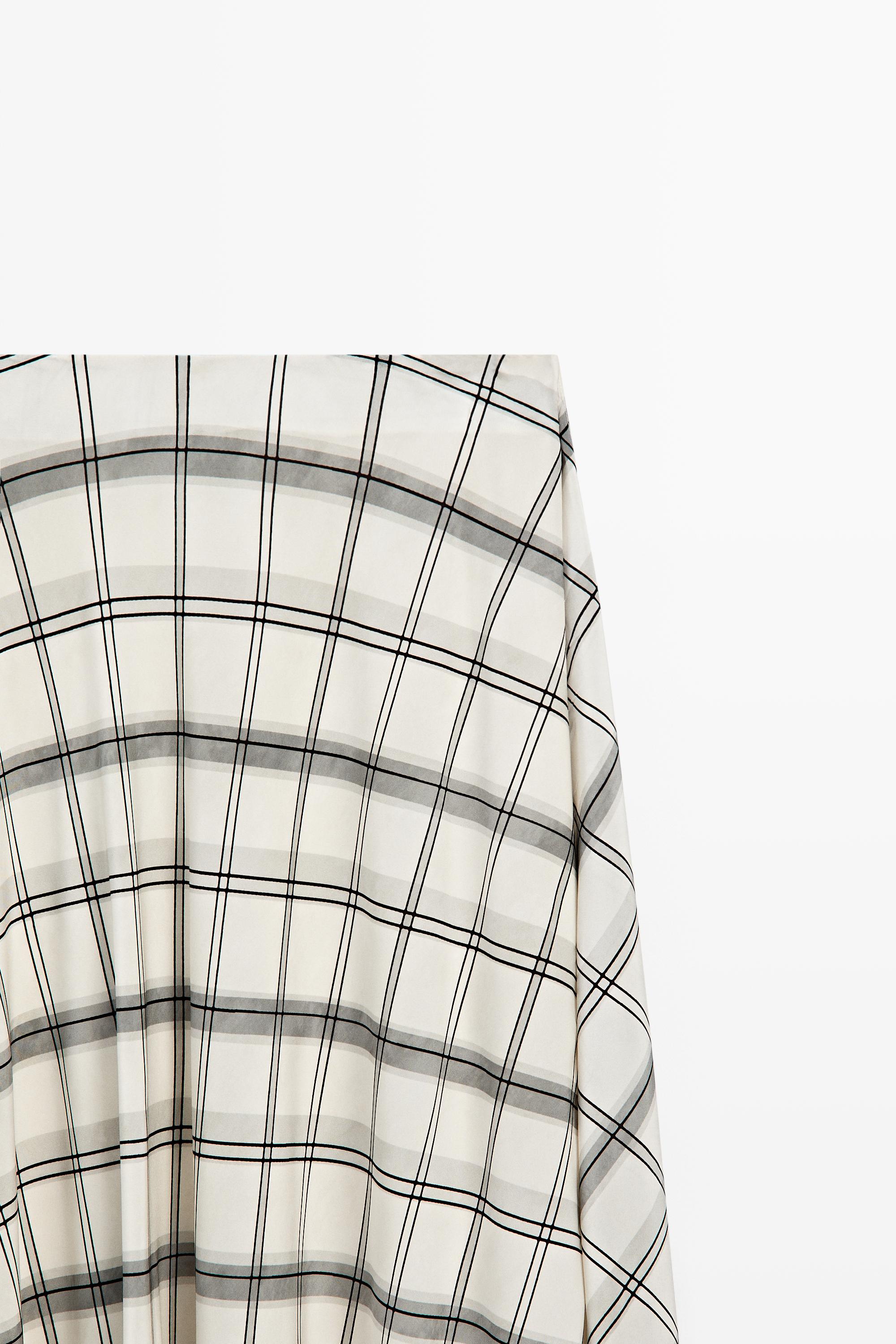 Jupe midi asymétrique à détail carreaux